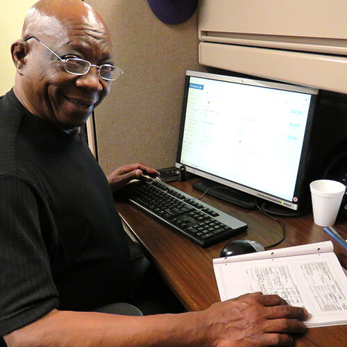 A tax prep volunteer waits for his next client.