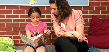 United Way Read to Succeed pairs volunteers with second and third grade students to help them improve their reading skills to stay on track in school.