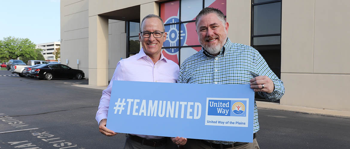 Steve Burt poses with his supervisor, Matt Lowe, on his first day at United Way.on