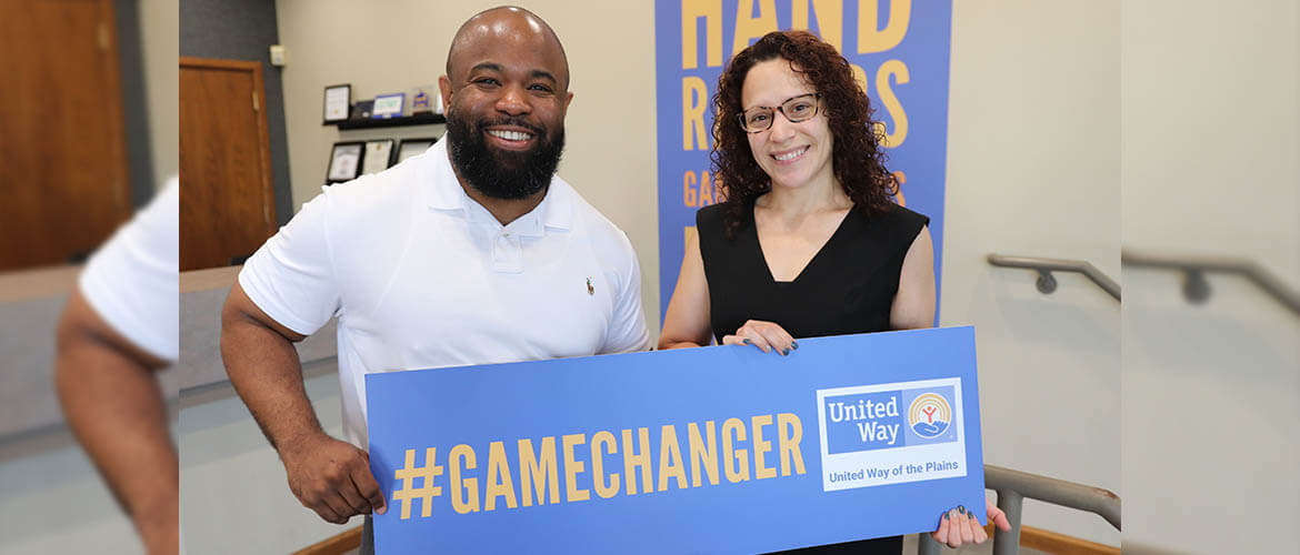 Nicky Cisneroz, United Way community engagement coordinator, stands with Abel Frederic, United Way Vice President of Community Impact.