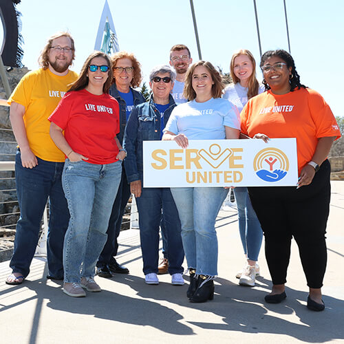 A group of Serve United members pose together.