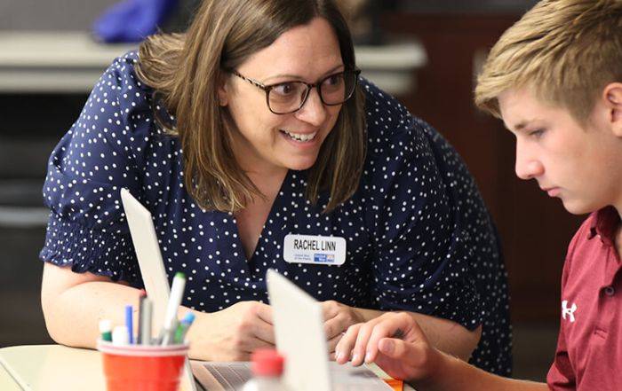 Rachel Linn, United Way Financial Stability Coordinator, assists a student at a financial education session.