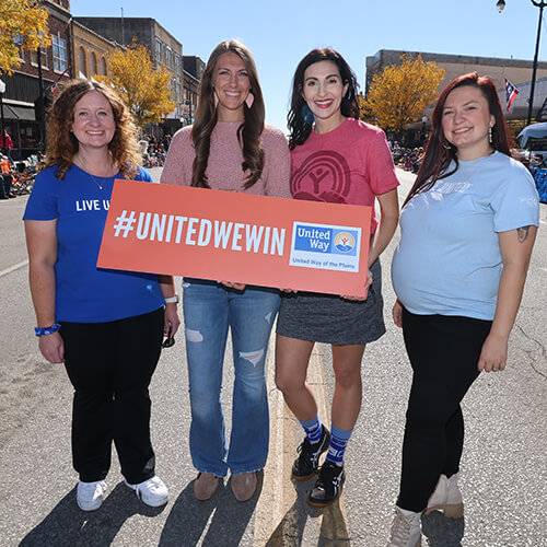 Brooklyn Black Ann Blog Cowley Outreach United Way Associate Director of Philanthropy Brooklyn Black poses with members of the philanthropy team at a community event in Cowley County.