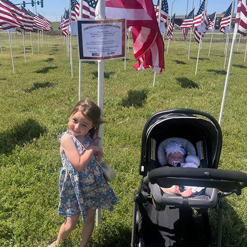 Brooklyn Black Ann Blog Family Brooklyn Black's two daughters pose with the flags at United Way's Flags of Freedom event to honor veterans and active-duty service members.