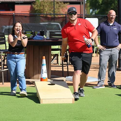 How To Be Involved_Fundraise_500 x 500_V2 Staff from The Law Company participate in a corn hole tournament to benefit United Way as part of their annual fundraising campaign.