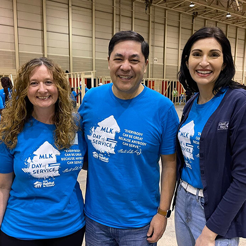 Jessie Gorges-Sawhill, United Way Director of Philanthropy, volunteers with coworkers at a Habitat for Humanity event.